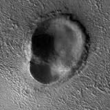 This odd-shaped Martian impact crater looks like an ear: See pic