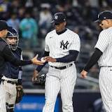 On his way back to the Yankees' bullpen, Aroldis Chapman resumes throwing off a mound